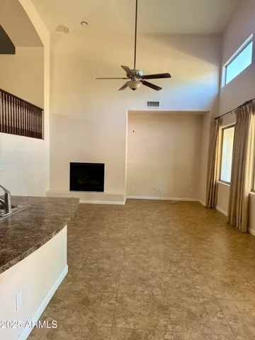 a view of a livingroom with a kitchen