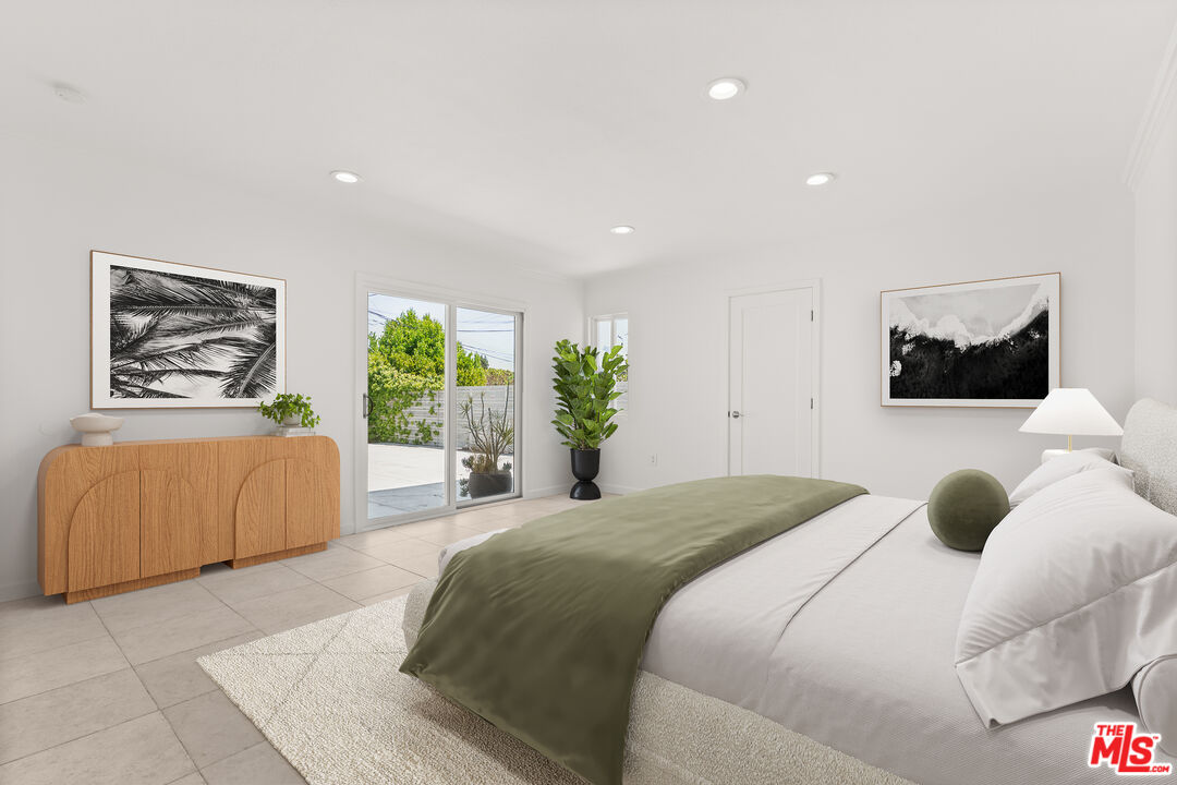 608 Lomita Street El Segundo, CA 90245 - Photo 17 of 37 a bedroom with a large bed and a couch