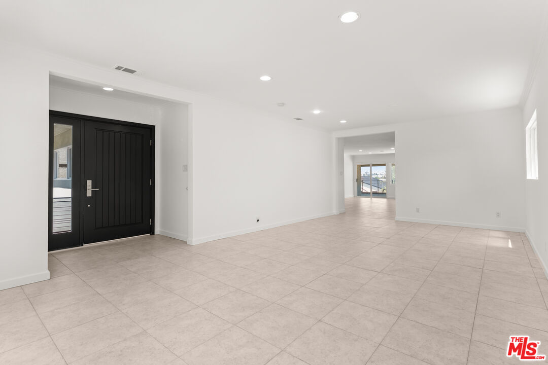 608 Lomita Street El Segundo, CA 90245 - Photo 3 of 37 a view of an empty room with glass door