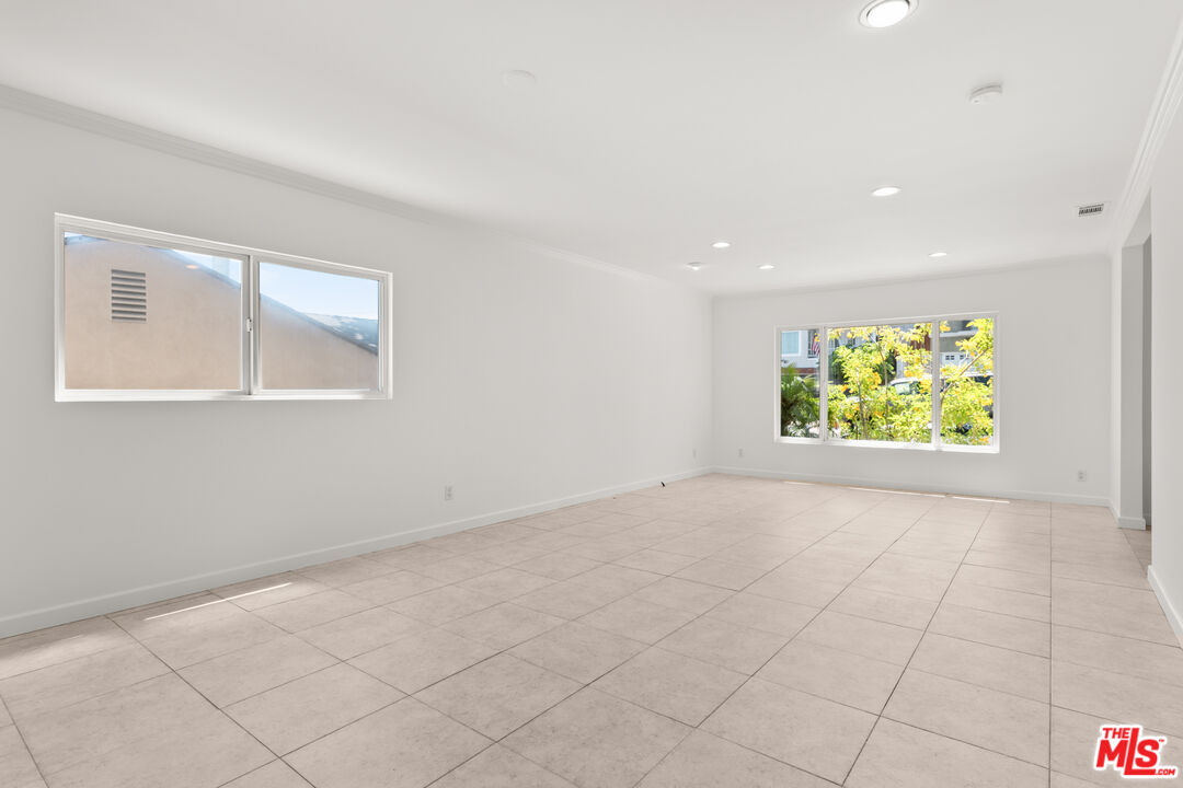 608 Lomita Street El Segundo, CA 90245 - Photo 5 of 37 a view of an empty room with a window