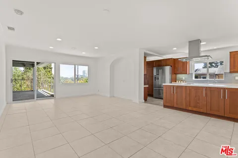 a view of a kitchen with a sink and window