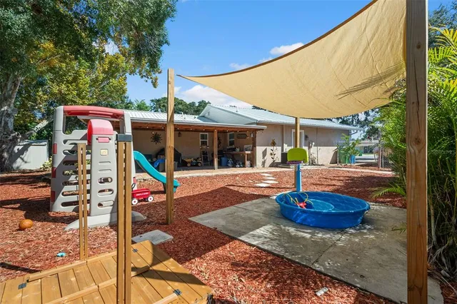 a view of a chairs and table in the patio