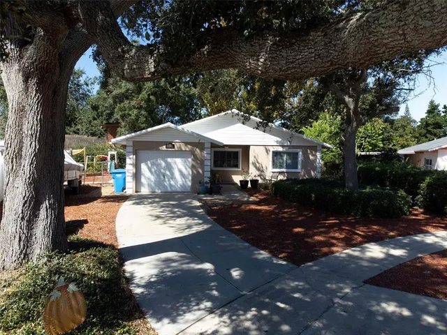 a front view of a house with yard