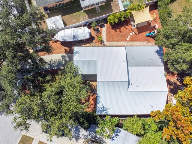 an aerial view of a house with outdoor space