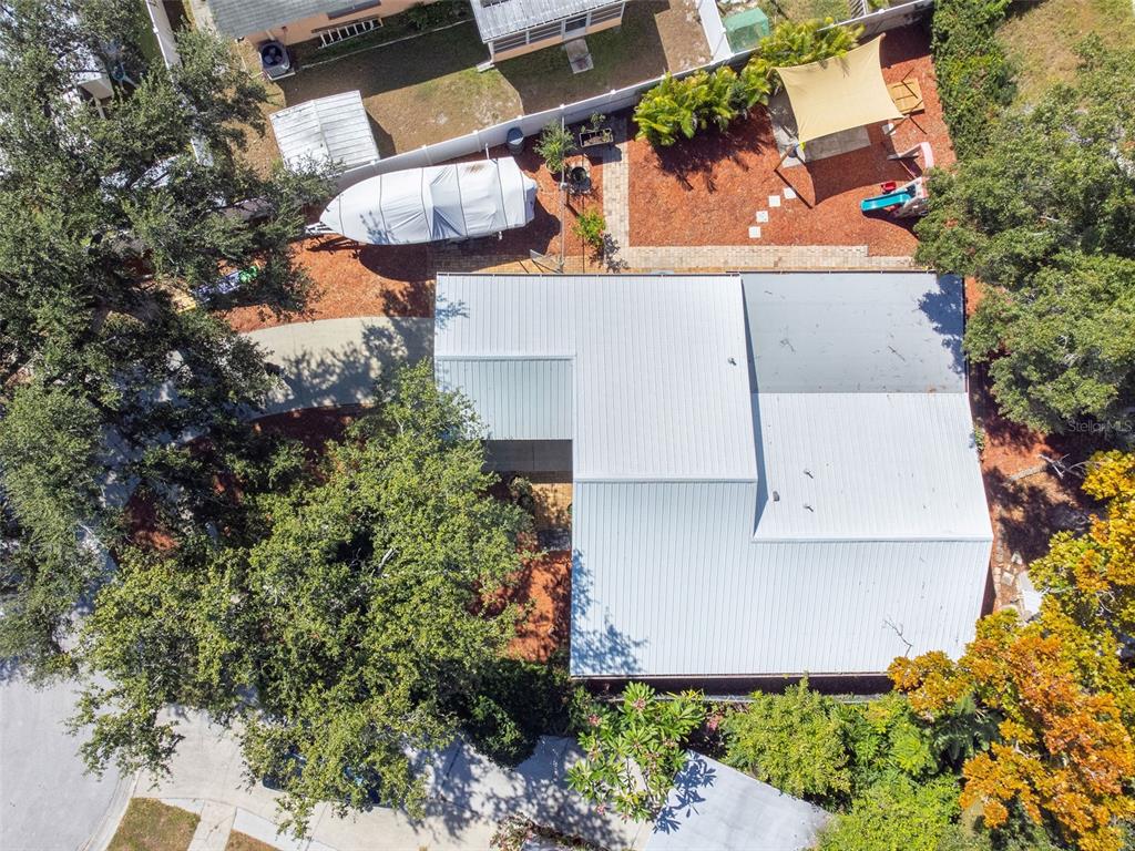 5558 57th Way Kenneth City, FL 33709 - Photo 29 of 33 an aerial view of a house with outdoor space