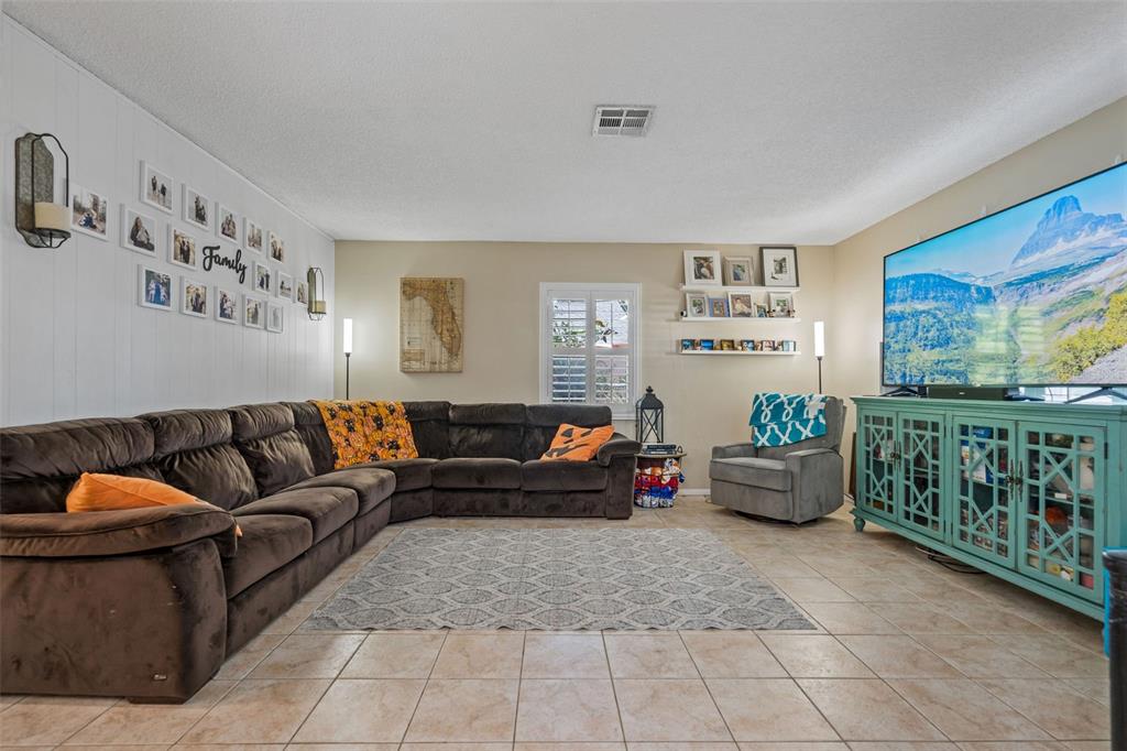 5558 57th Way Kenneth City, FL 33709 - Photo 5 of 33 a living room with furniture