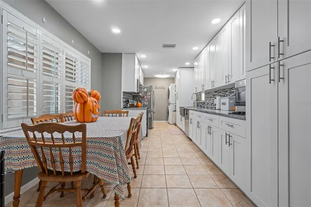 a dining room with furniture and wooden floor