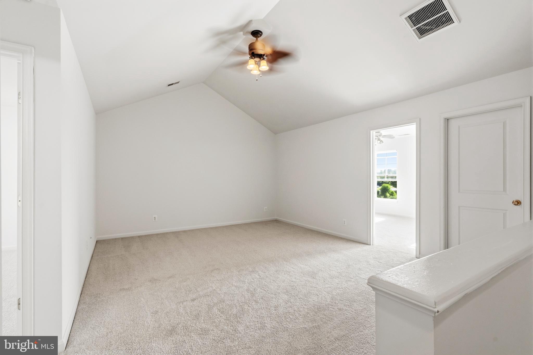 9227 Ribbon Falls Loop Bristow, VA 20136 - Photo 45 of 53 an empty room with a window and a ceiling fan