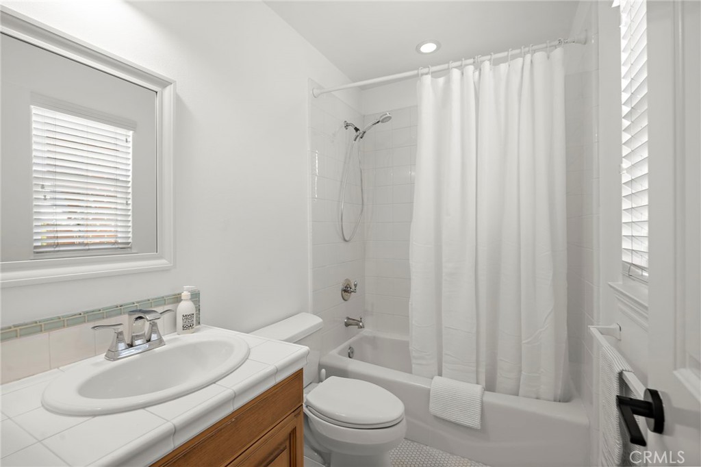 3 Tranquility Place Ladera Ranch, CA 92694 - Photo 34 of 63 a bathroom with a sink toilet a mirror and shower