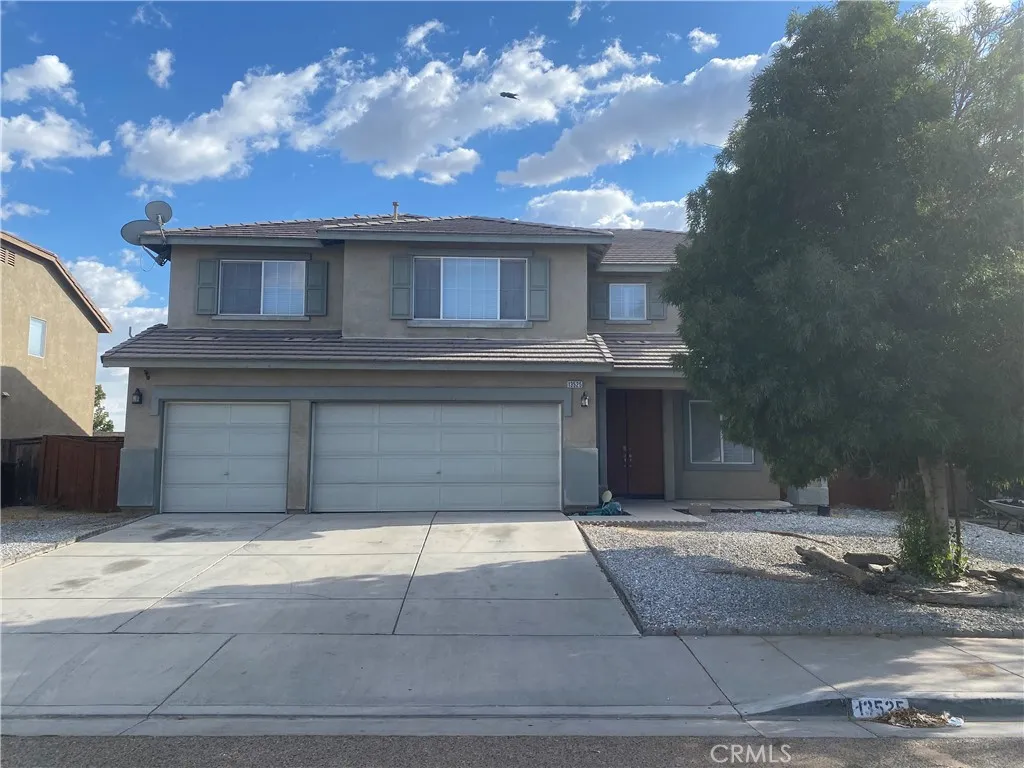13525 Silversand Street Victorville, CA 92394 - Photo 1 of 2 a view of a house with a yard