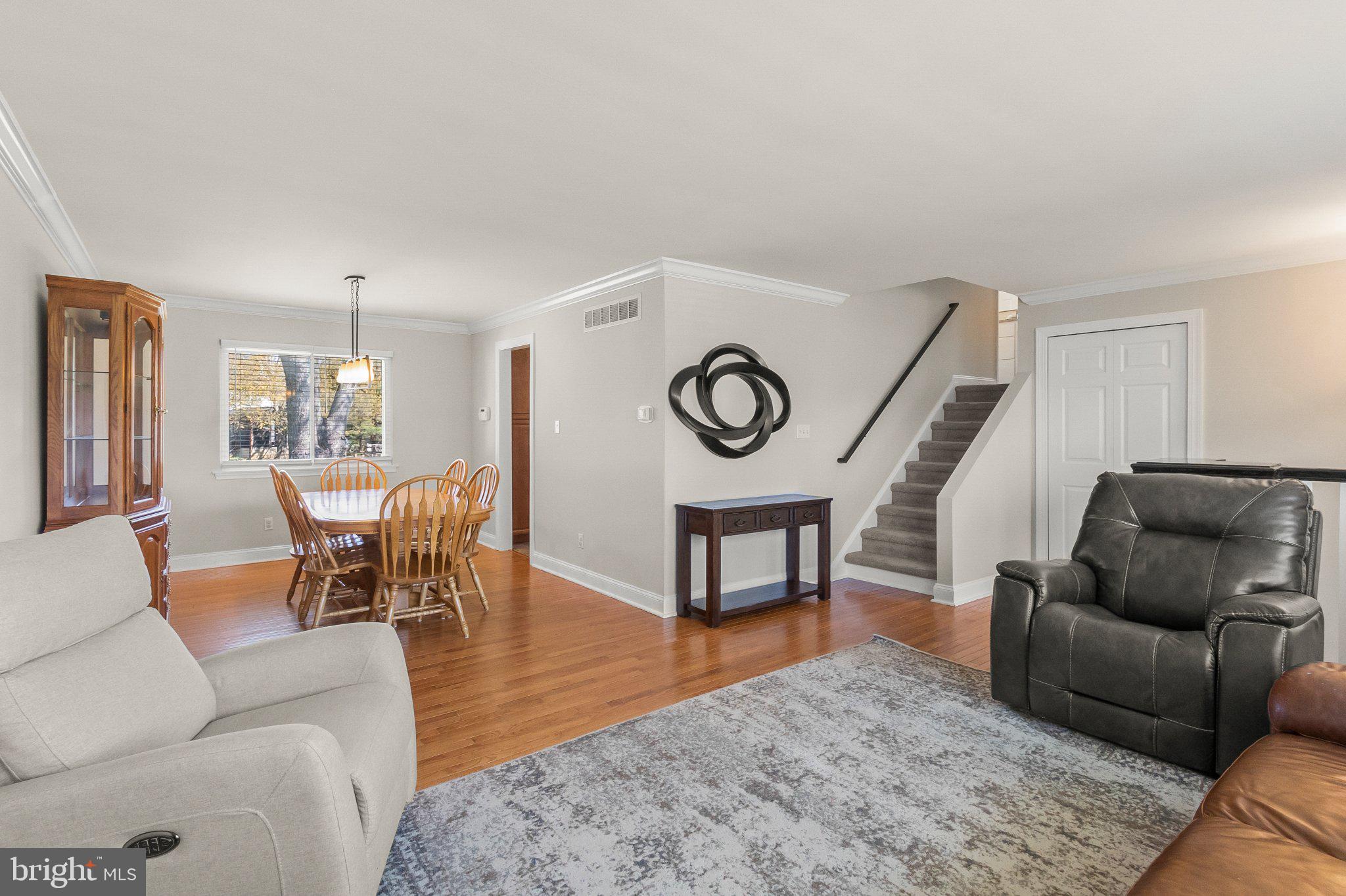 8 Slates End Newark, DE 19702 - Photo 18 of 54 a living room with furniture and a clock
