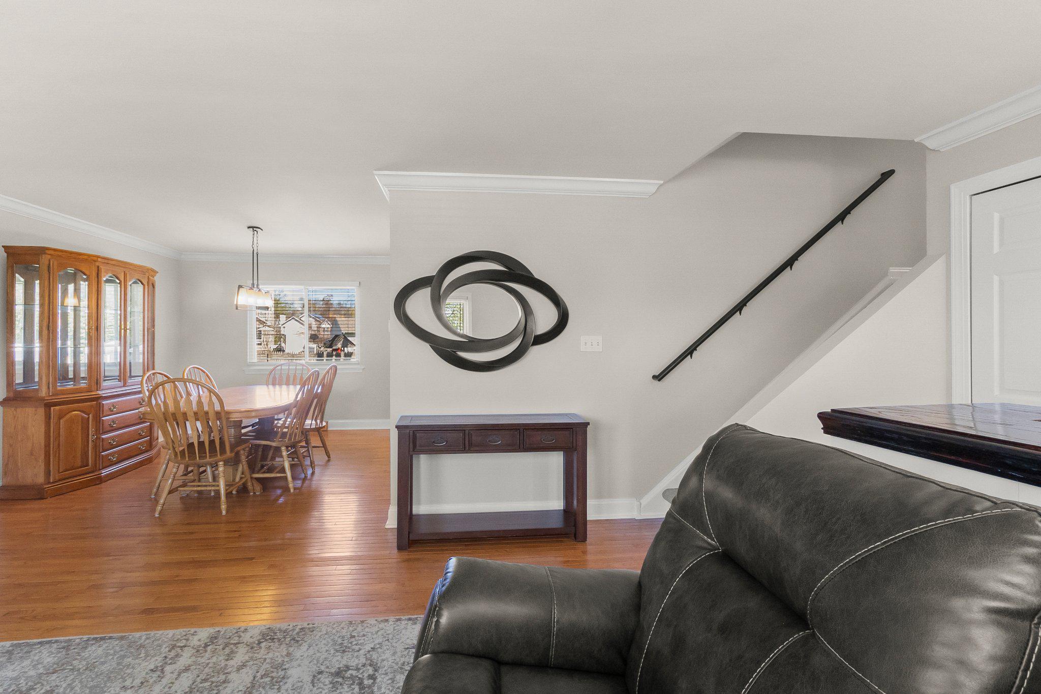 8 Slates End Newark, DE 19702 - Photo 19 of 54 a living room with furniture and a clock