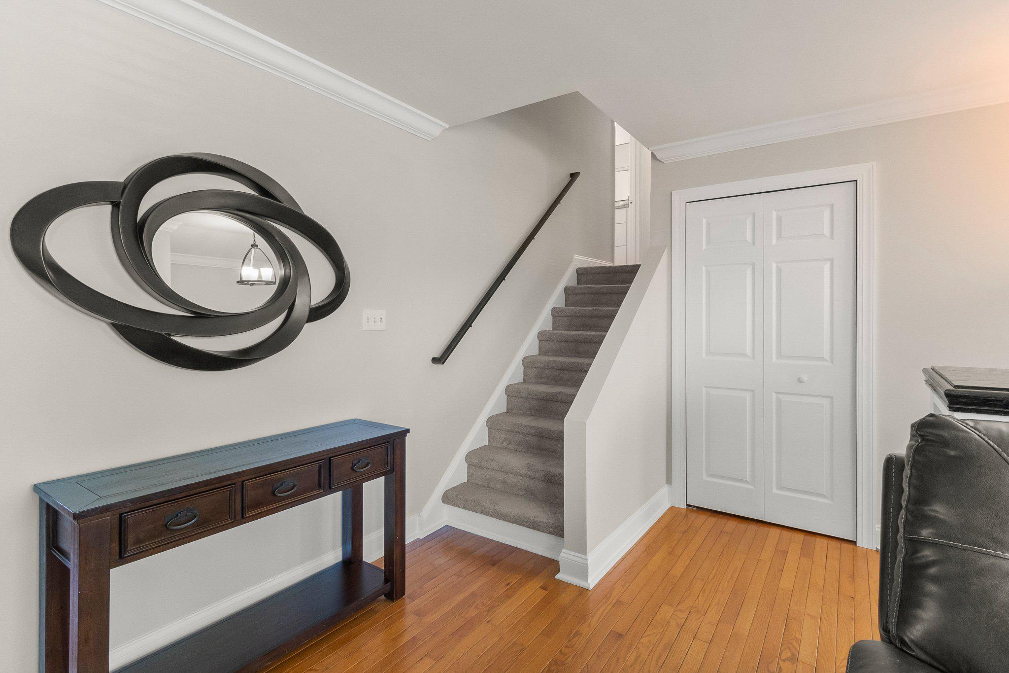 8 Slates End Newark, DE 19702 - Photo 20 of 54 a view of a hallway with entryway wooden floor and front door