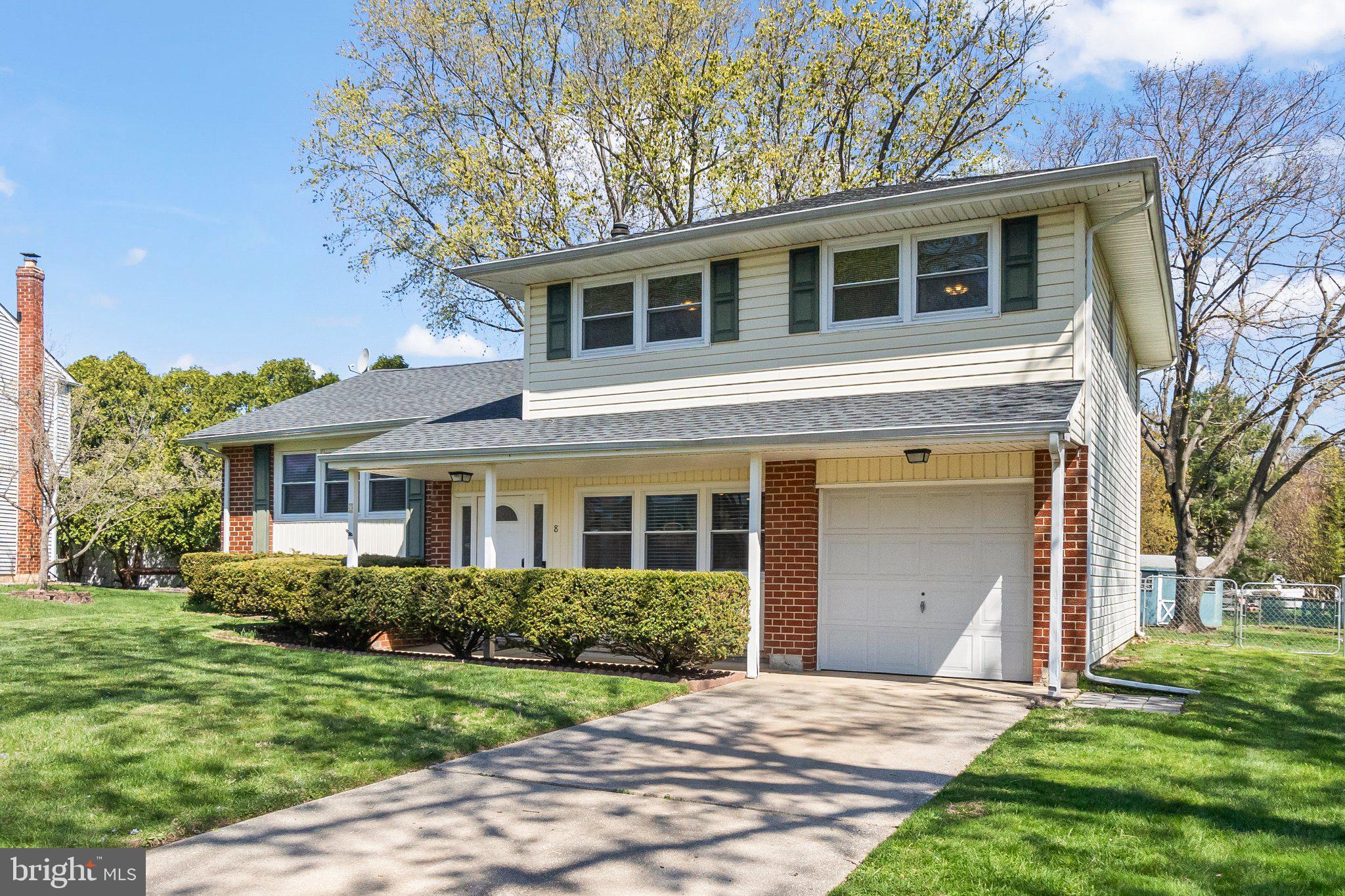 8 Slates End Newark, DE 19702 - Photo 2 of 54 a front view of a house with a yard and trees