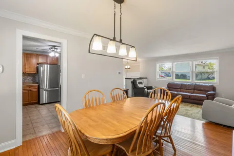 a kitchen with stainless steel appliances granite countertop a refrigerator sink and stove