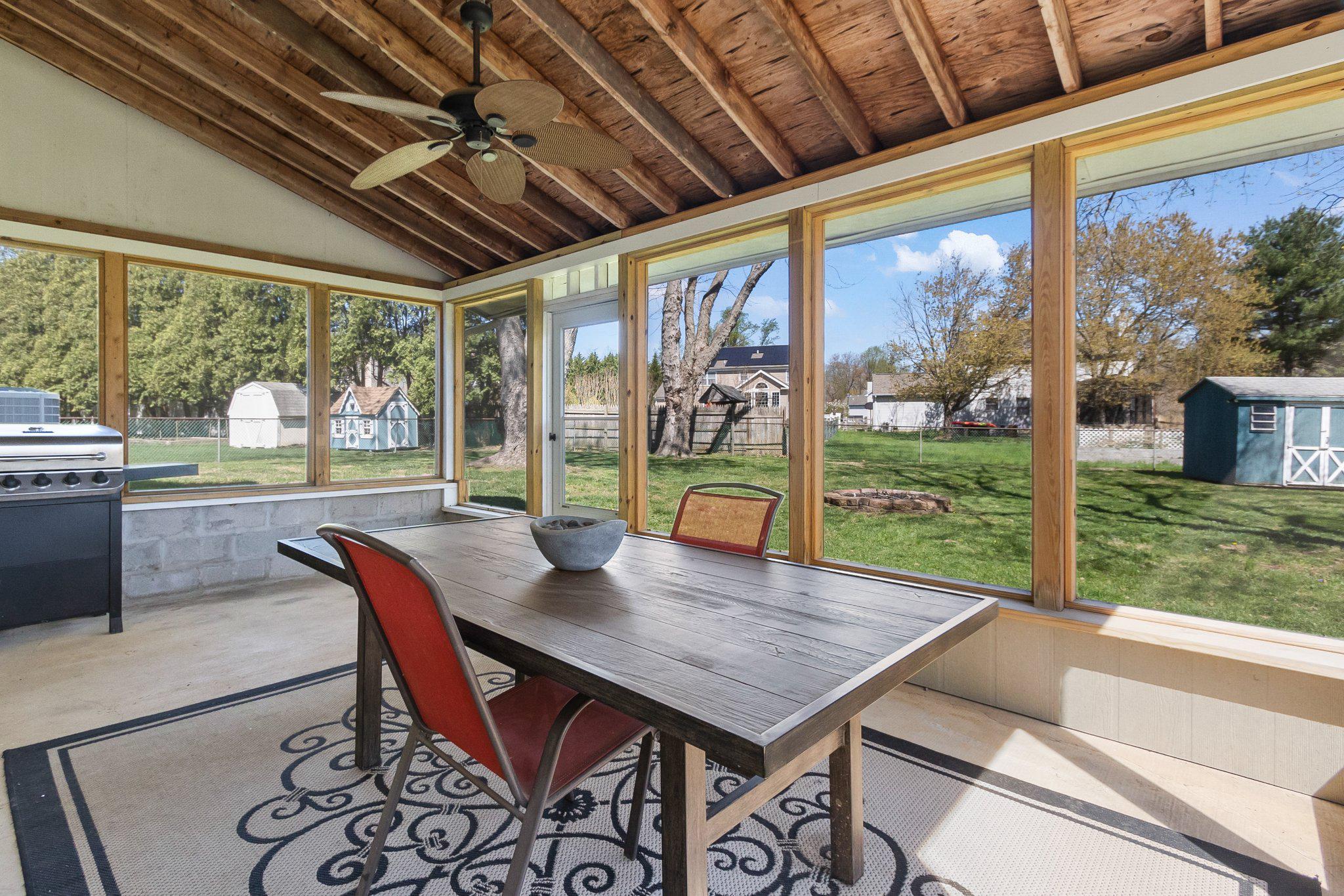 8 Slates End Newark, DE 19702 - Photo 42 of 54 a view of a dining room with furniture large windows and wooden floor