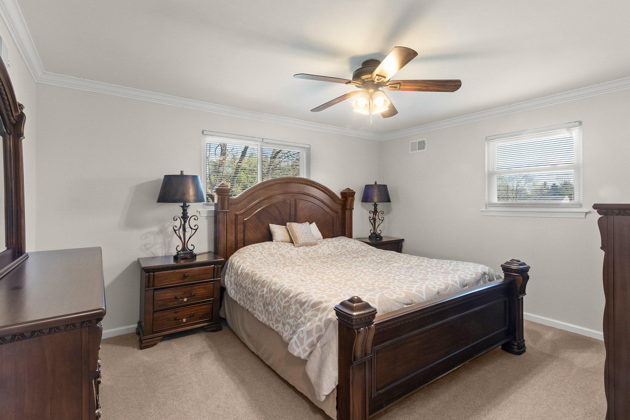 8 Slates End Newark, DE 19702 - Photo 47 of 54 a bedroom with a bed and a chandelier