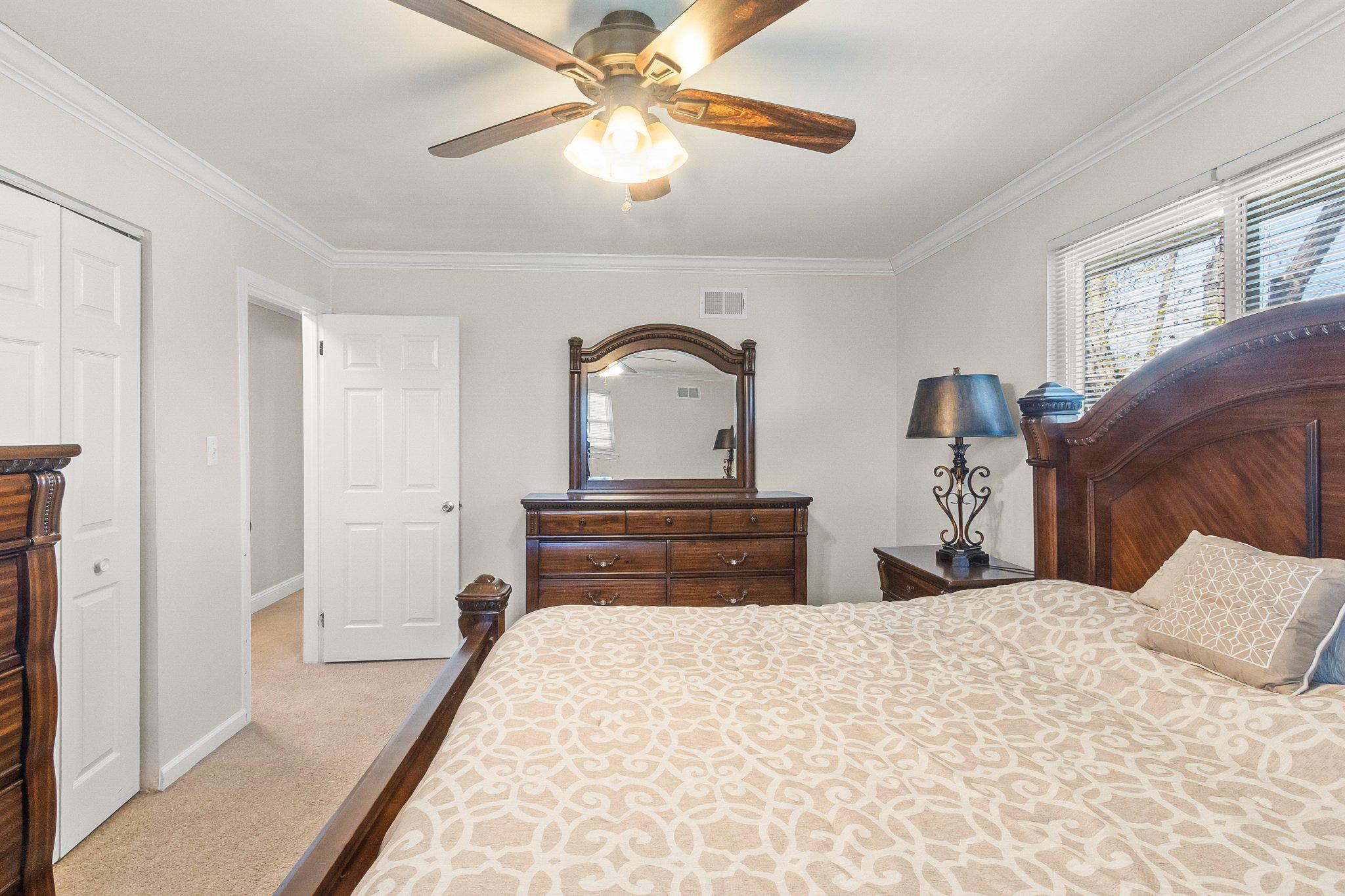 8 Slates End Newark, DE 19702 - Photo 49 of 54 a bedroom with a bed and a chandelier