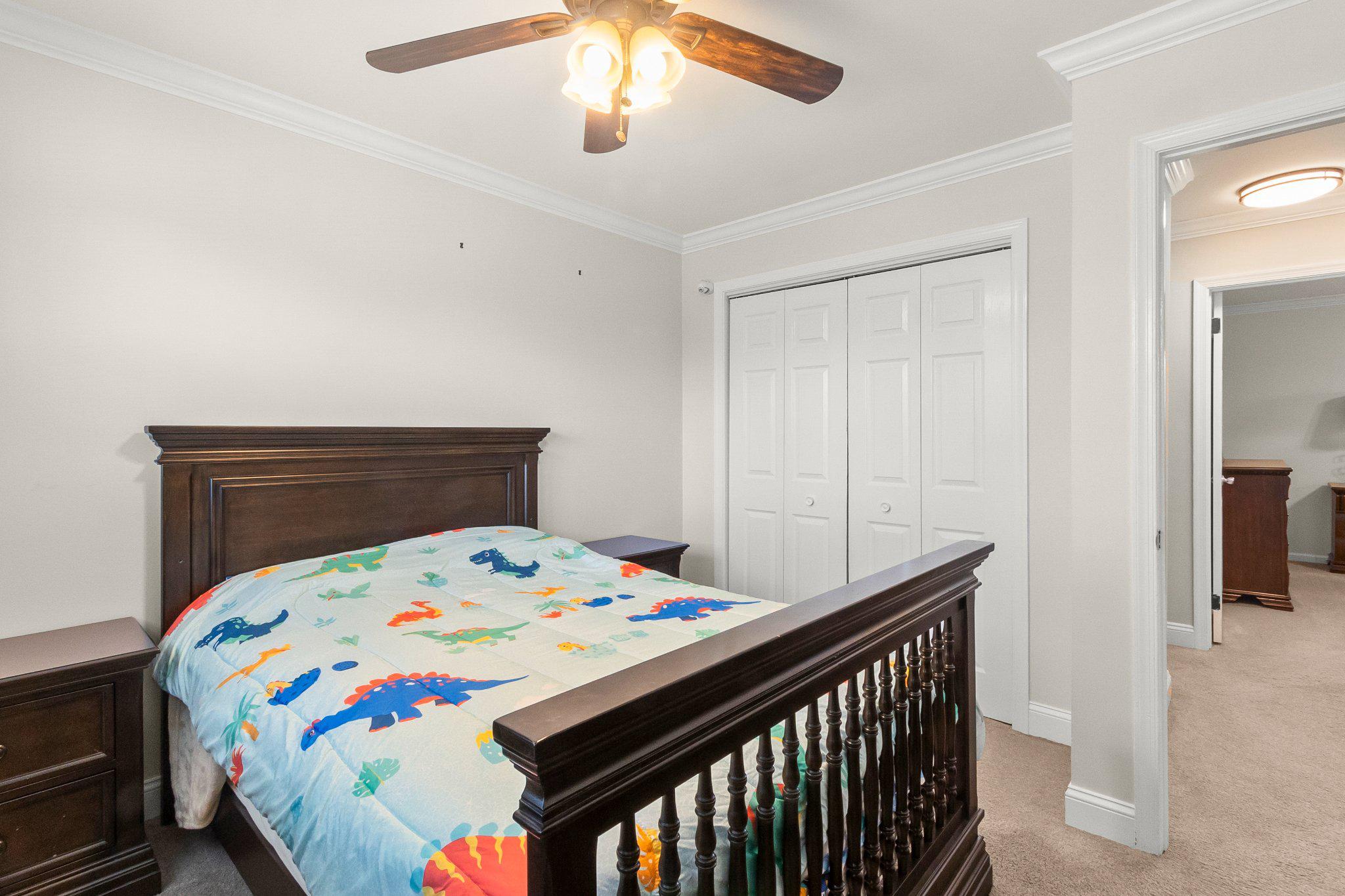 8 Slates End Newark, DE 19702 - Photo 54 of 54 a bedroom with a bed and a chandelier
