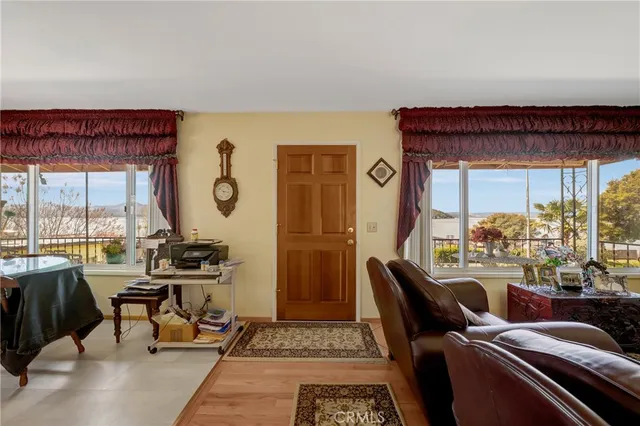 a view of a dining room with furniture window and outside view