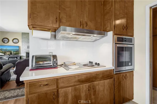 a kitchen with a refrigerator and a sink