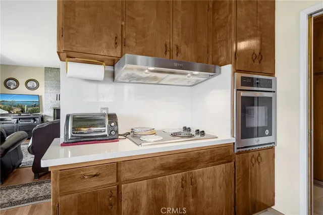 a kitchen with a refrigerator and a sink