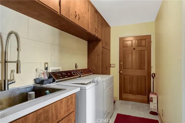 a kitchen with stainless steel appliances granite countertop a sink and cabinets