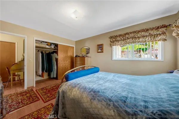 a living room with furniture a rug and a window