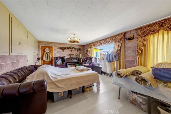 a room with furniture and a large window