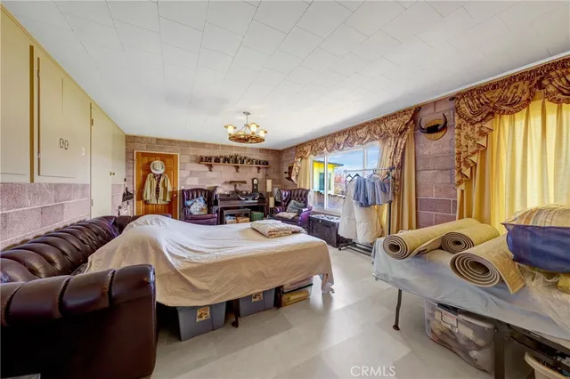 a room with furniture and a large window