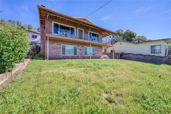 a view of a house with a yard and plants