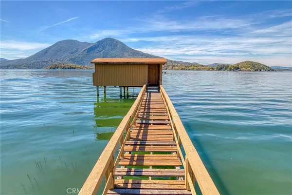 a view of balcony with wooden floor and a floor to ceiling window