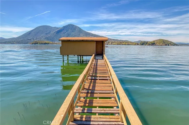 a view of balcony with wooden floor and a floor to ceiling window