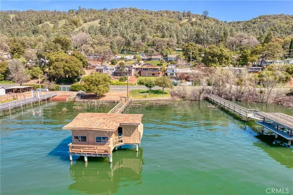 a view of a house with a yard from a balcony