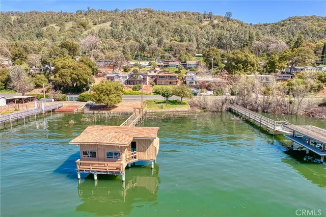a view of a house with a yard from a balcony