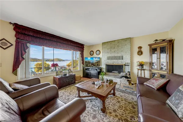 a living room with furniture a couch and bookshelf