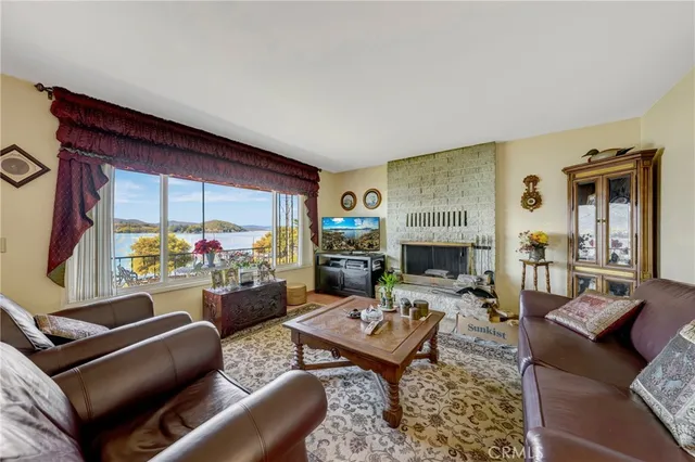 a living room with furniture a couch and bookshelf