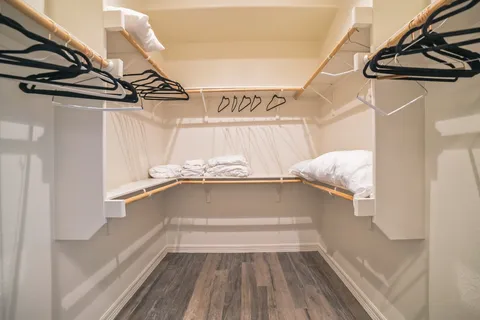 a bathroom with a tub shower and a sink