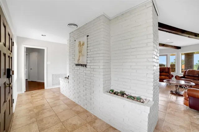 a spacious bathroom with a granite countertop sink a toilet and a mirror