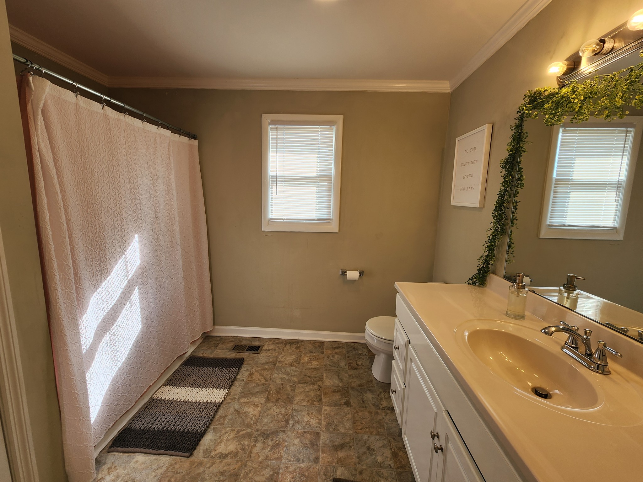 890 Tom Grissom Road Morrison, TN 37357 - Photo 13 of 17 a bathroom with a sink a toilet and a mirror