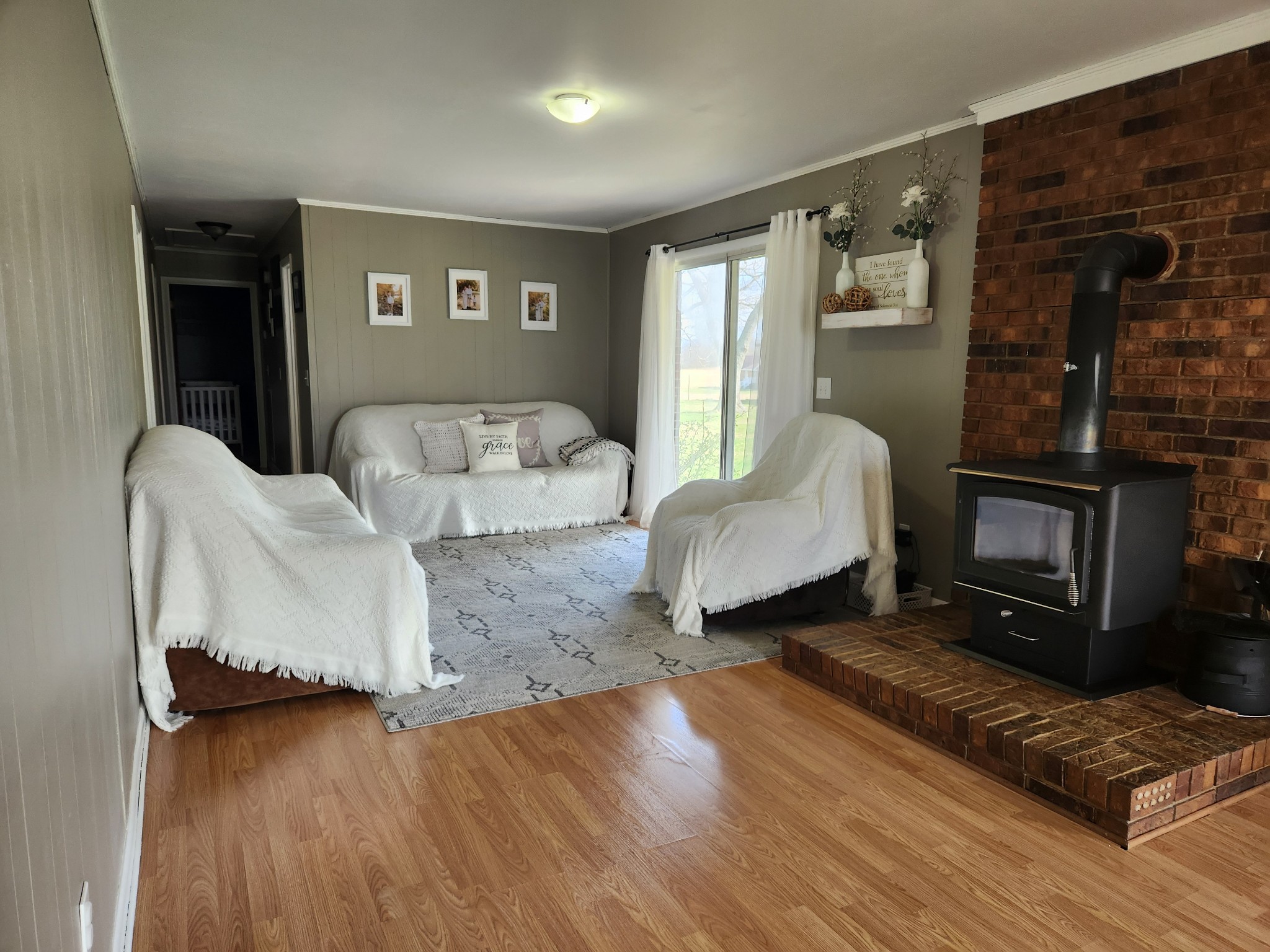 890 Tom Grissom Road Morrison, TN 37357 - Photo 2 of 17 a living room with furniture and a fireplace