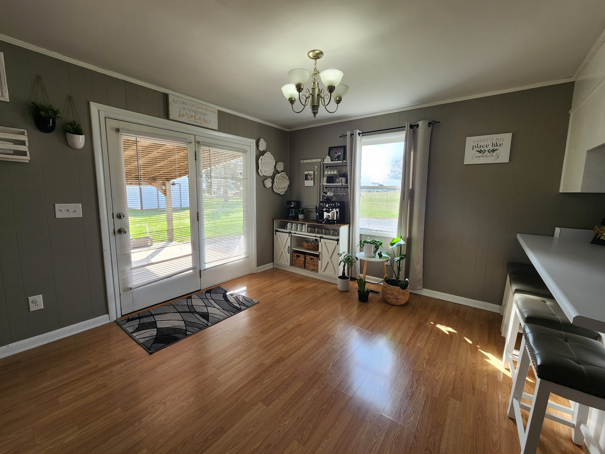 890 Tom Grissom Road Morrison, TN 37357 - Photo 4 of 17 a view of an empty room with a window and wooden floor
