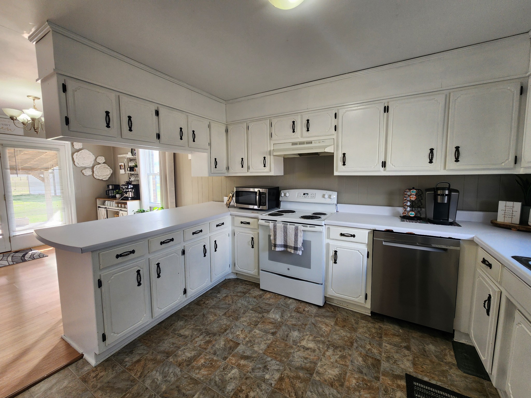 890 Tom Grissom Road Morrison, TN 37357 - Photo 7 of 17 a kitchen with white cabinets white stainless steel appliances and sink