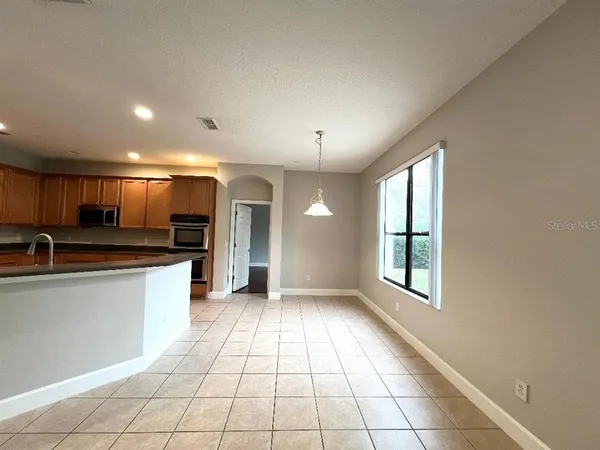 a kitchen with stainless steel appliances granite countertop a sink and cabinets