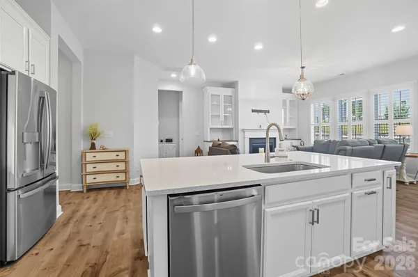 a large white kitchen with lots of counter space