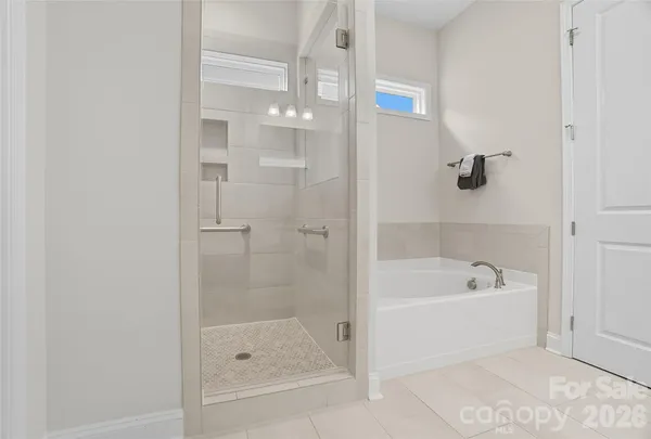 a utility room with sink dryer and washer