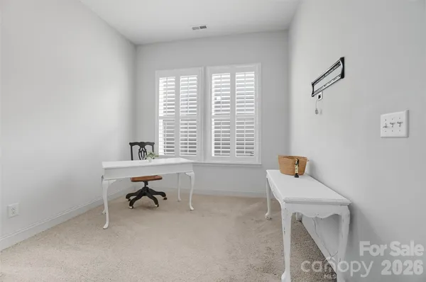 a view of livingroom with furniture and a window