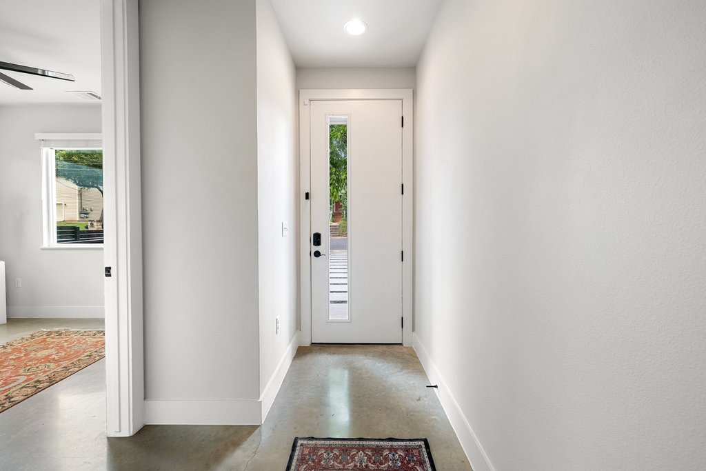 1182 Ridgeway Drive, Unit A Austin, TX 78702 - Photo 5 of 35 a view of a hallway with wooden floor and staircase