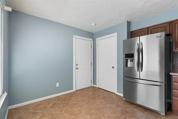 a view of kitchen and windows