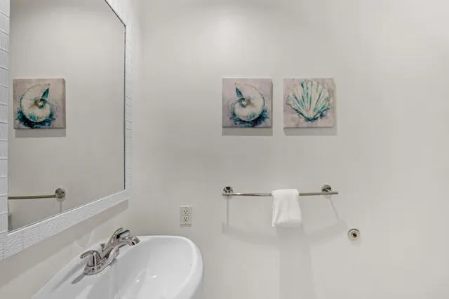 a view of hallway with furniture and a potted plant